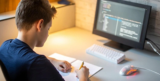 Child working on KidTech IoT Innovators Program