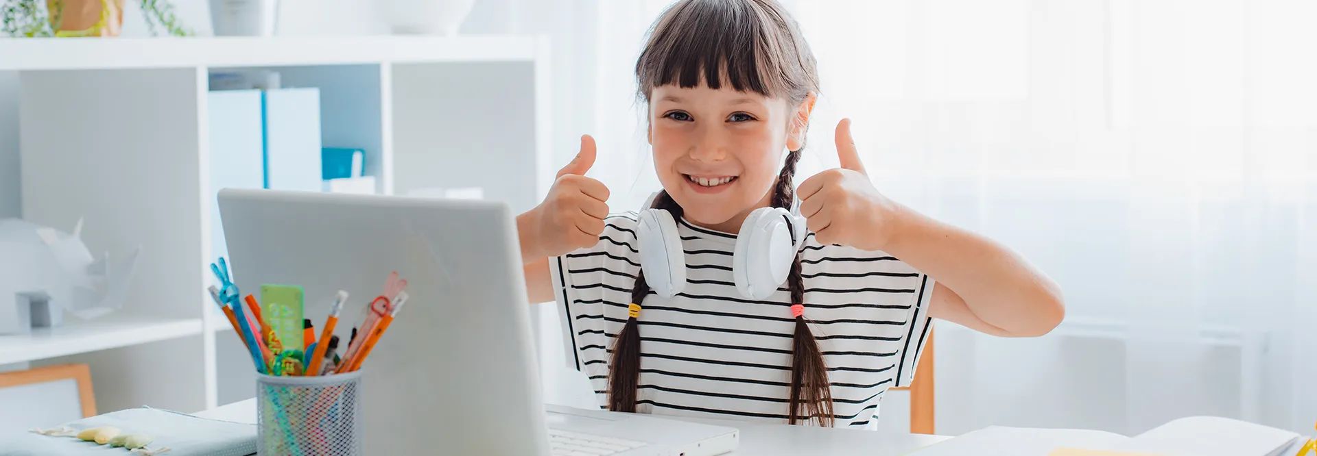 Student engaged in interactive online math learning session with headphones