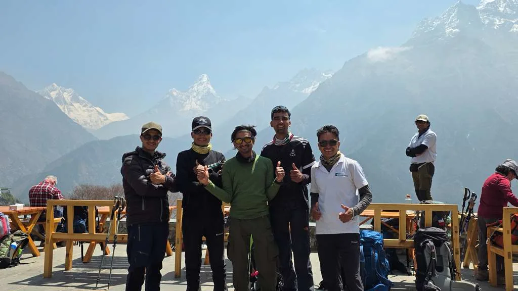 Trekkers sharing a meal together in a teahouse dining room