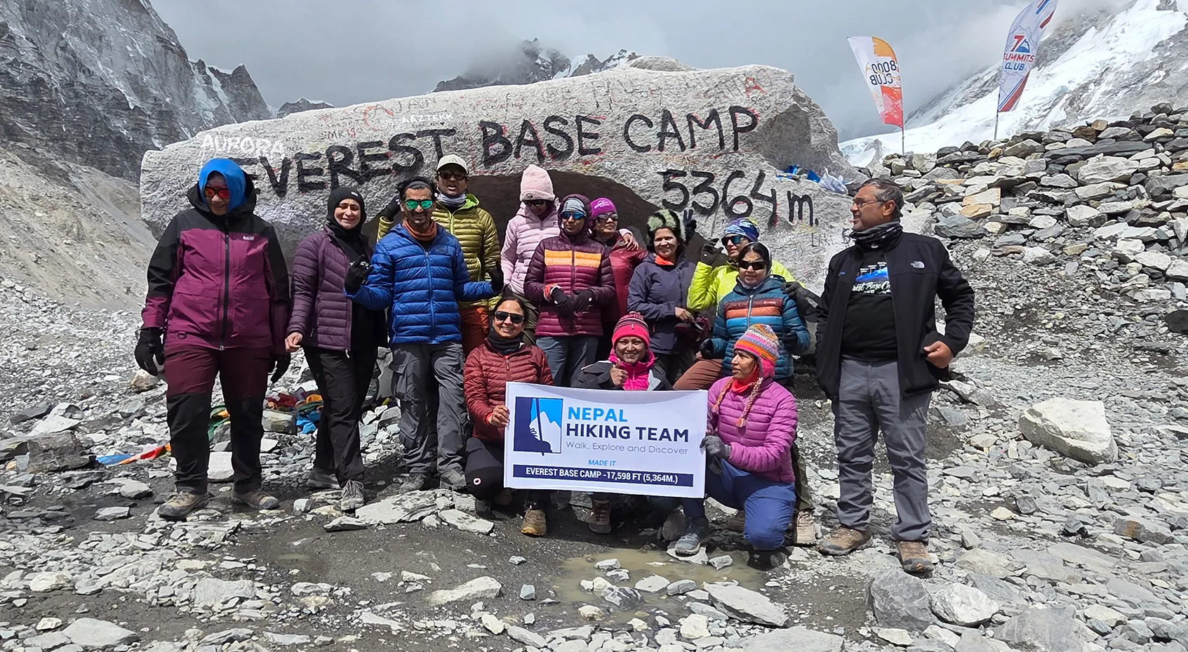 The full trekking team at the Everest Base Camp 5,364m marker rock