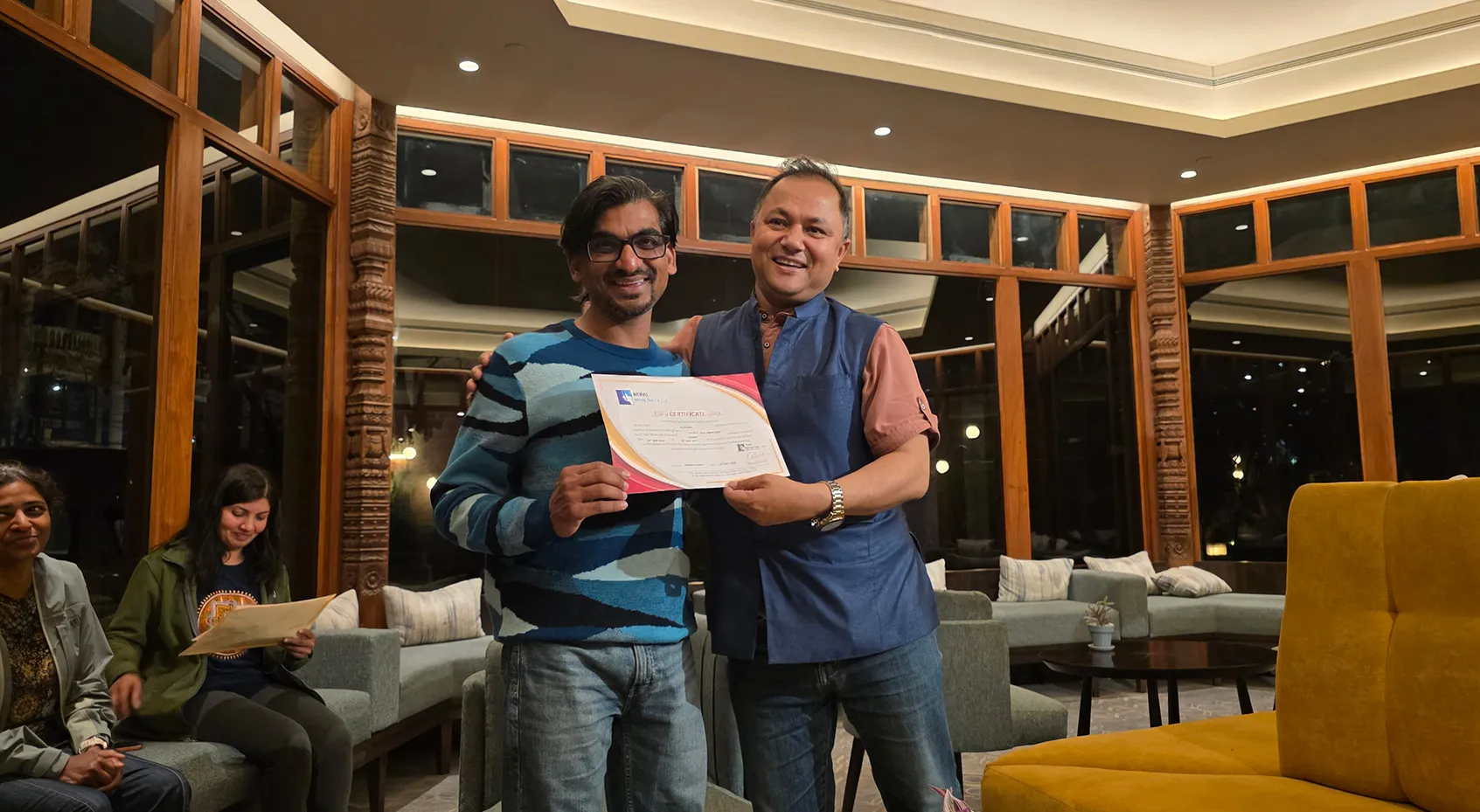 Alok receiving his Everest Base Camp trek completion certificate
